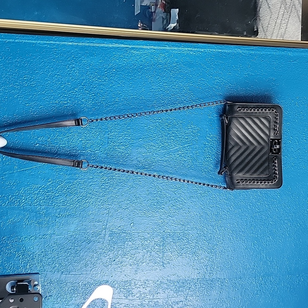 A black chain cross body black bag